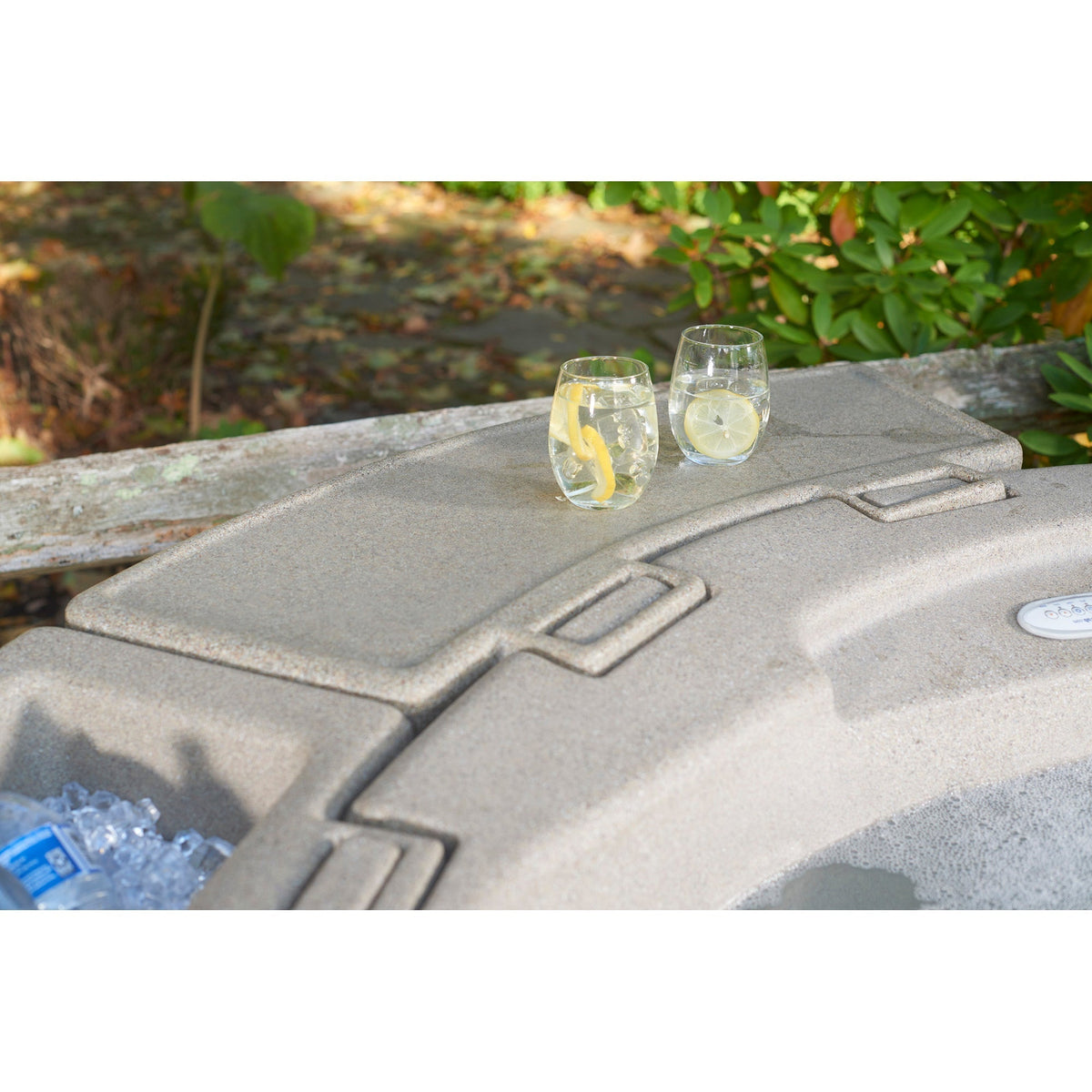 tan esin tray with beverages in a backyard