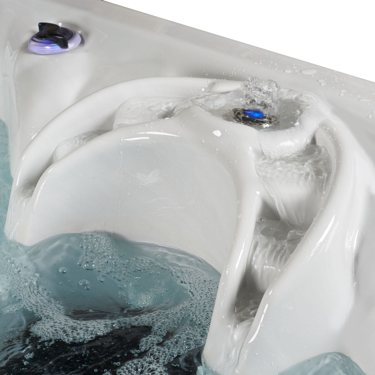 Hot tub with water and bubbles, showing a water cascade