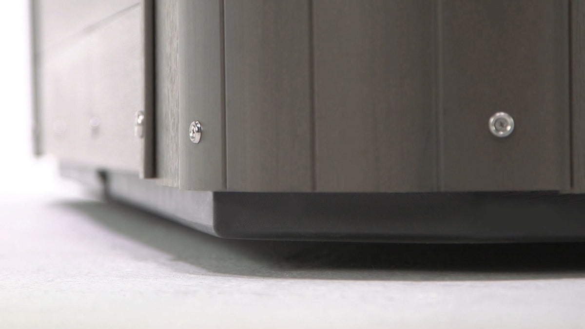 low profile of black base attached to grayish hot tub cabinet