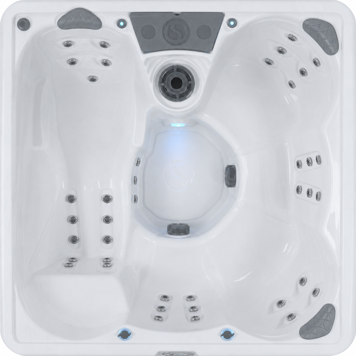 Top-down view of a white outdoor hot tub featuring multiple jets and a blue LED light glow in the center. #seating_lounger
