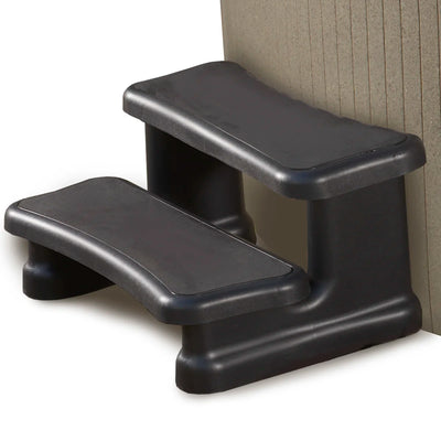 Two-step black plastic steps with textured non-slip surfaces, shown against a white background with a beige curved hot tub panel on the right.