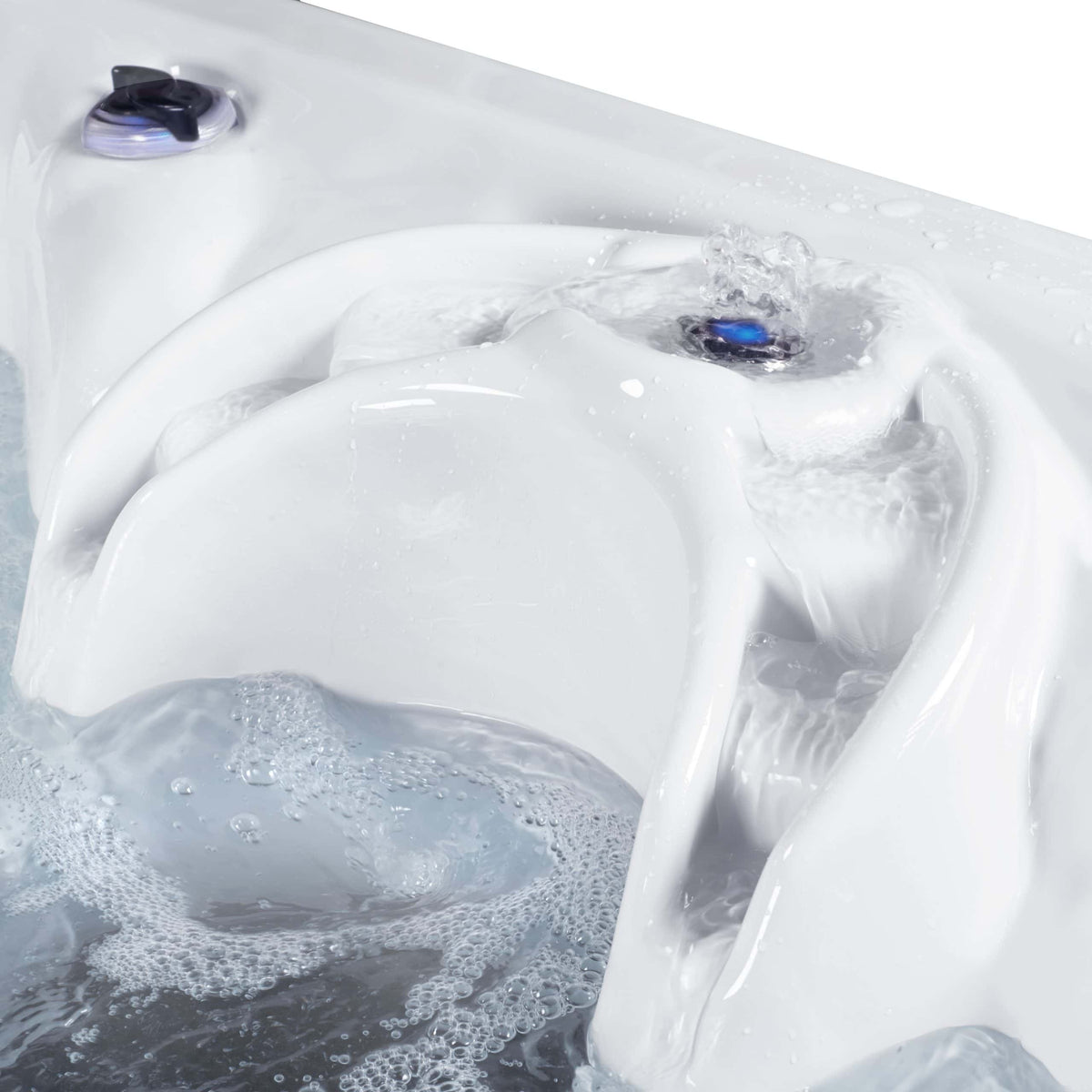 Hot tub water cascade, showing bubbles and foam.