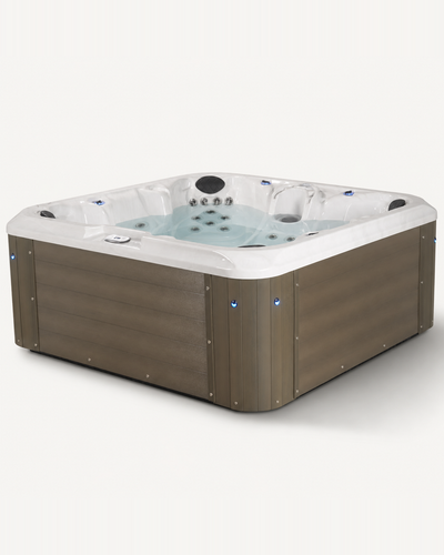A square hot tub with a brown wood-look exterior and a white interior, shown on a plain light background. 