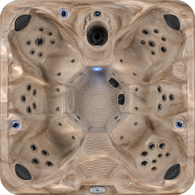 Top view of a hot tub with multiple jets and a central light. 