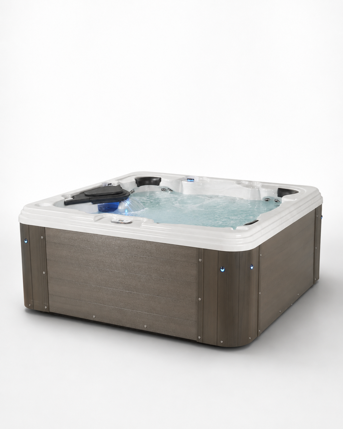A hot tub with a gray wood-look exterior and a white interior, filled with bubbling water. The hot tub features integrated jets and a control panel on the top left, photographed on a seamless white background. 