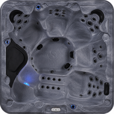 Top view of a hot tub with multiple jets and a blue light.