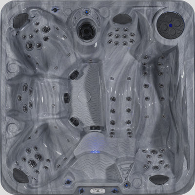 Top-down view of a gray and white marbled hot tub with multiple jets, and blue LED lighting accents. 
