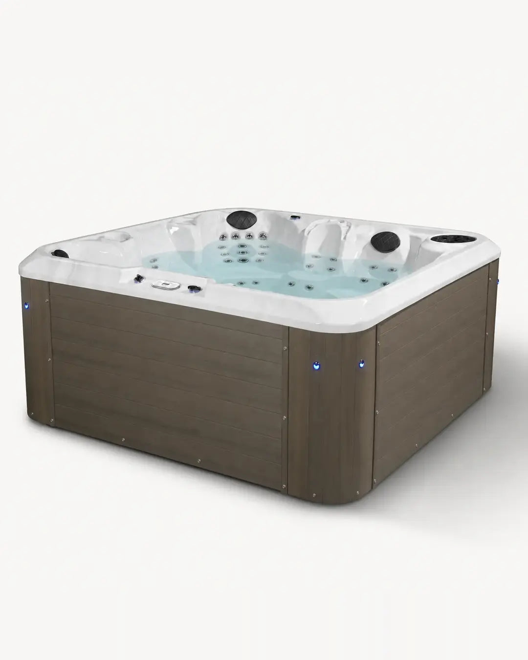 A square hot tub with a brown wood-look exterior and a white interior, filled with light blue water. The hot tub features multiple jet nozzles and small blue LED accent lights on the front corners, shown against a plain white background.