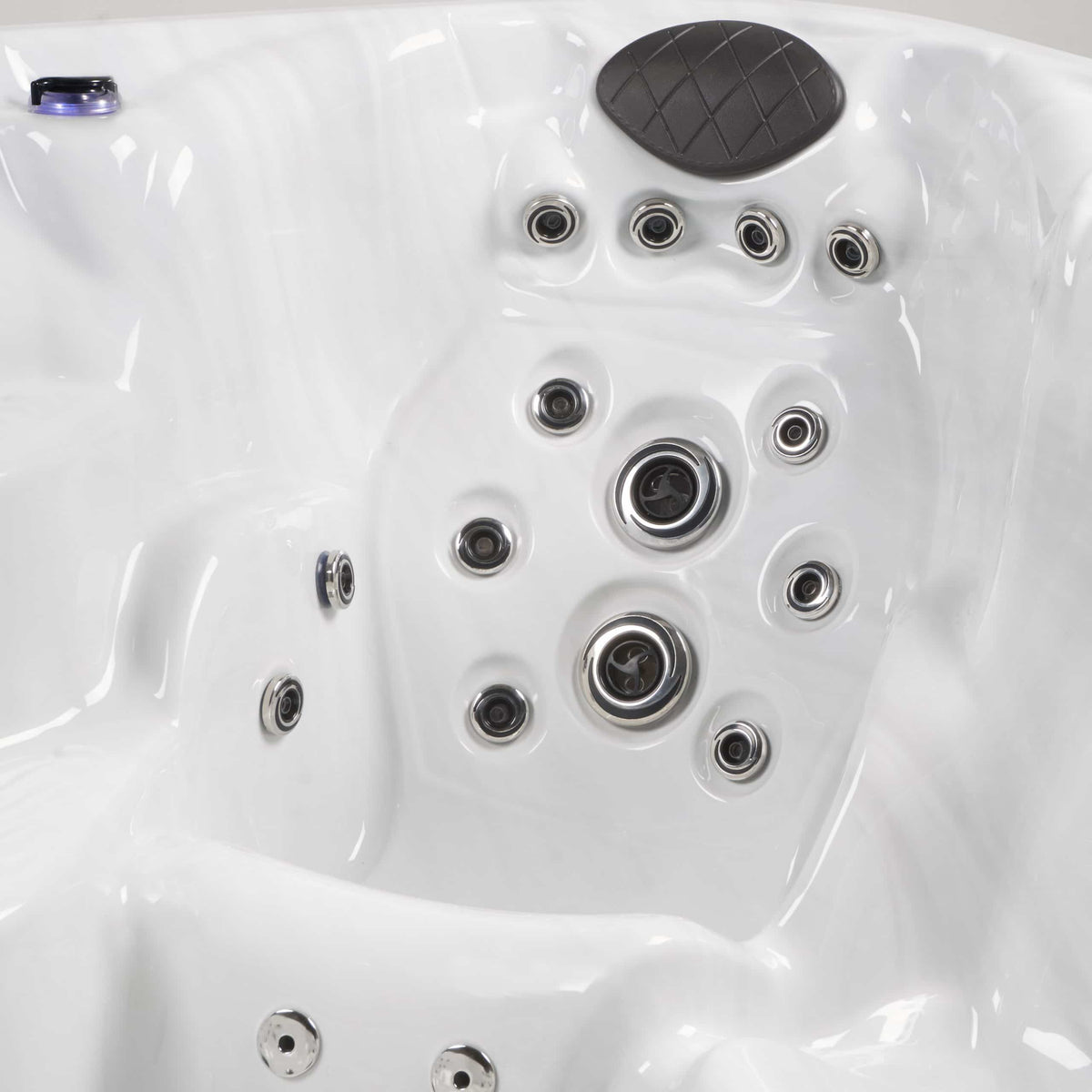 Close-up of a hot tub with multiple jets.