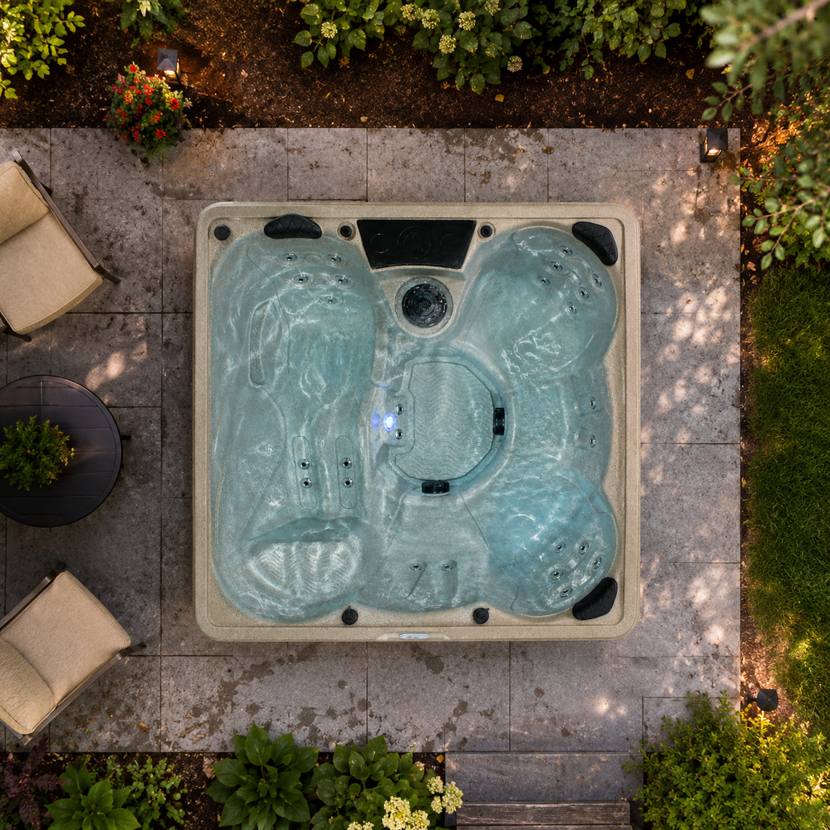 Outdoor hot tub in a garden setting with surrounding plants and furniture.