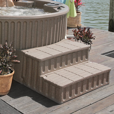 Tan storage steps with adapter for round hot tubs, shown on a deck with hot tub, plants and water