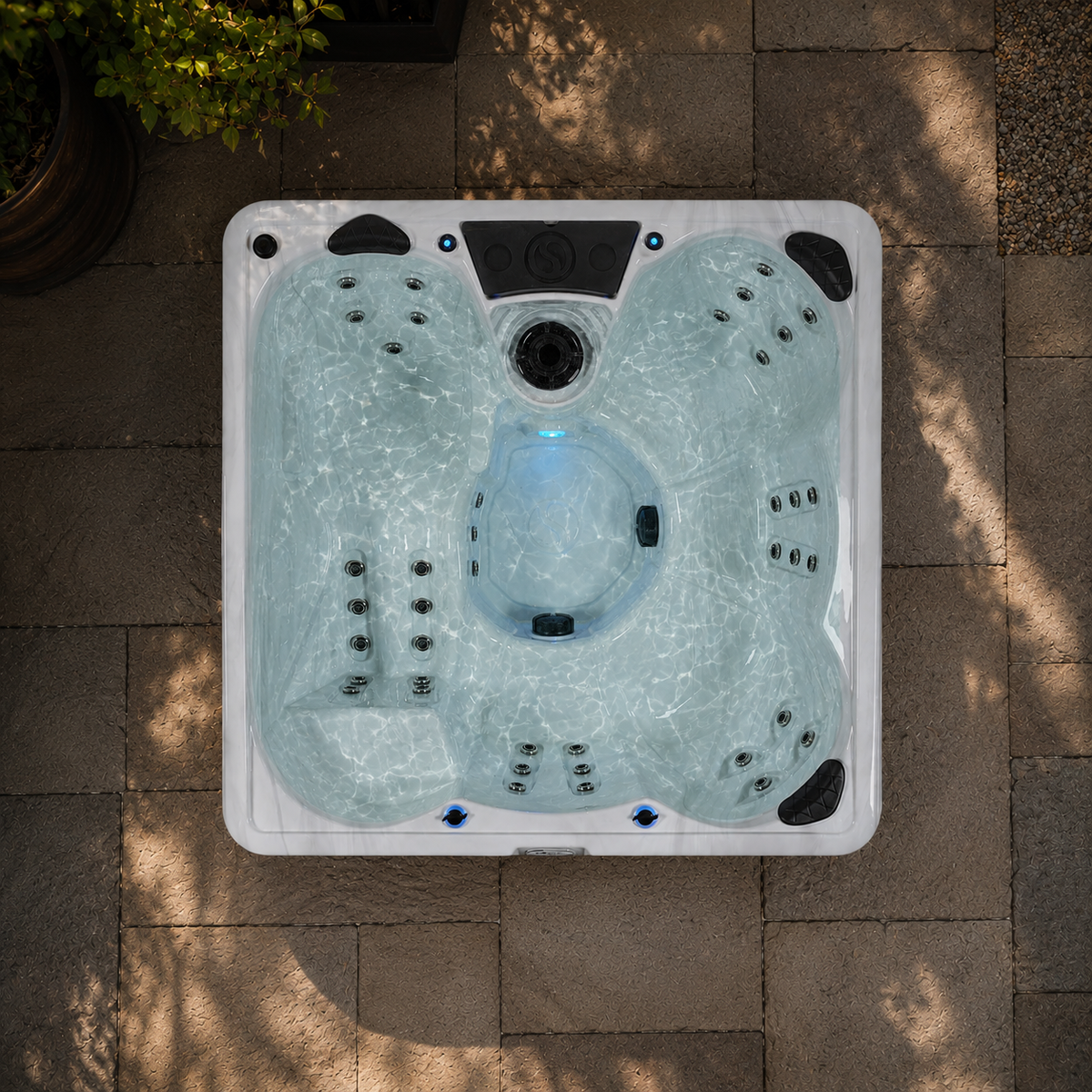 Top view of a hot tub on a paved patio