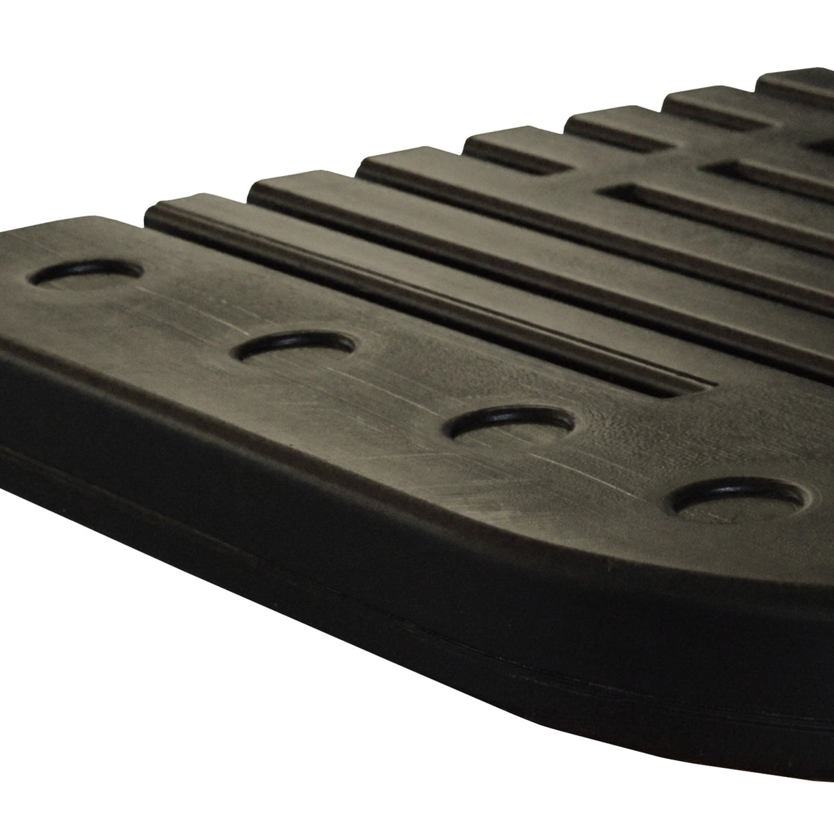 Close-up of a black spa base with a ribbed tread pattern and circular cutouts, shown on a white background.
