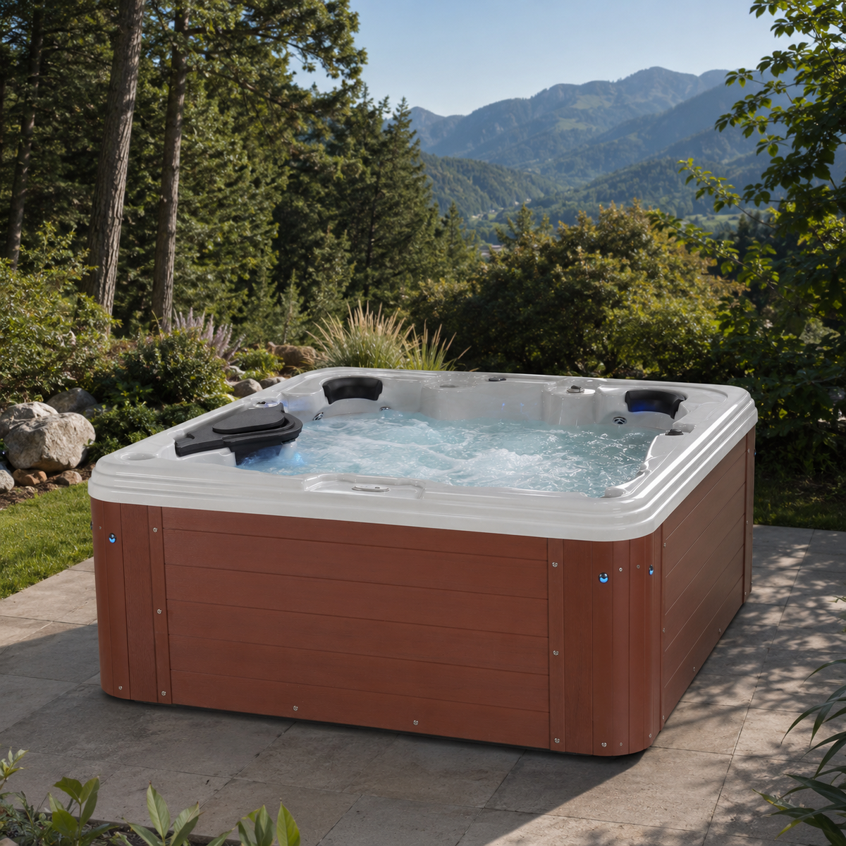Hot tub in a garden setting with mountains in the background