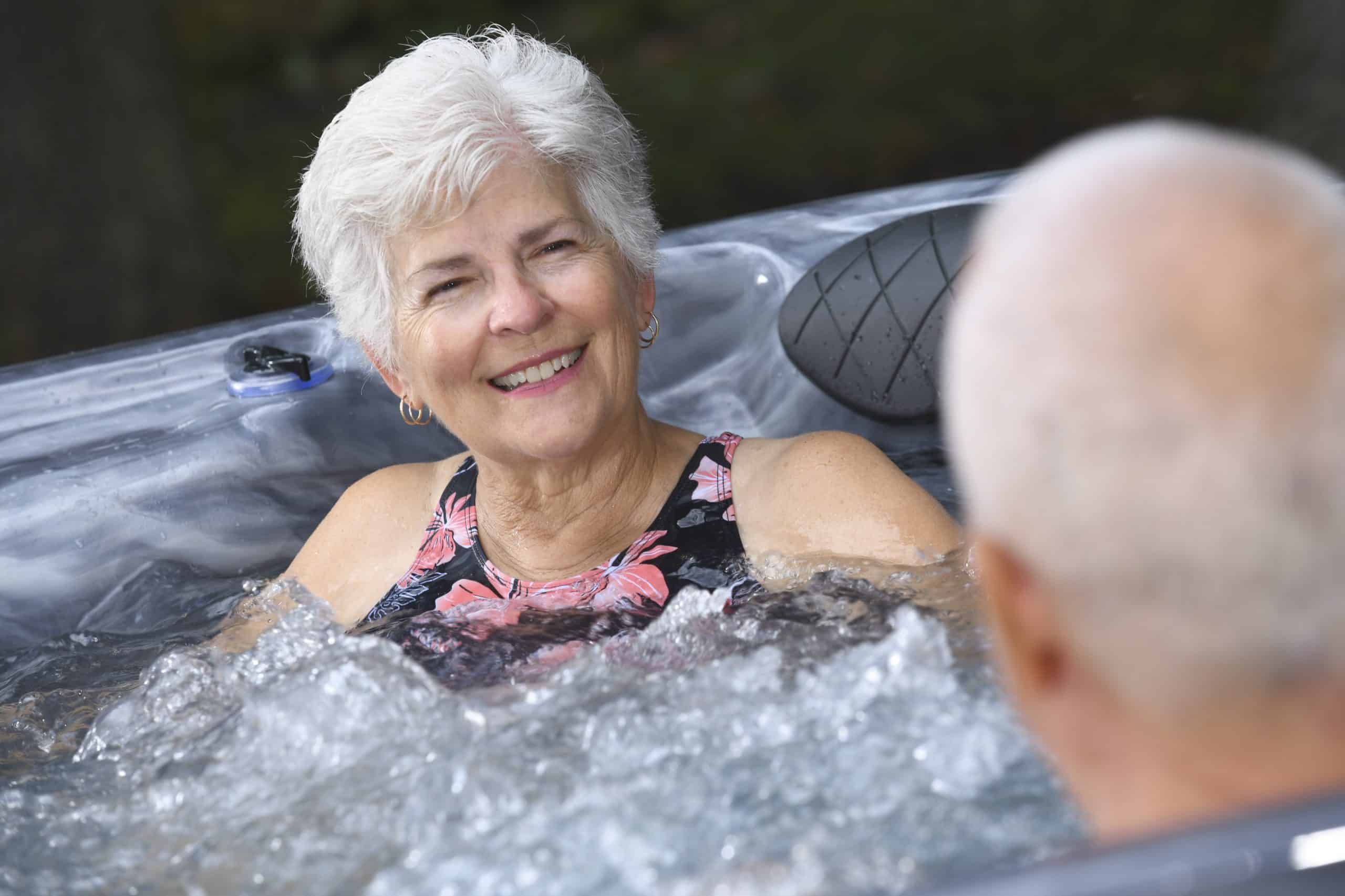 Couple enjoying a hot tub.