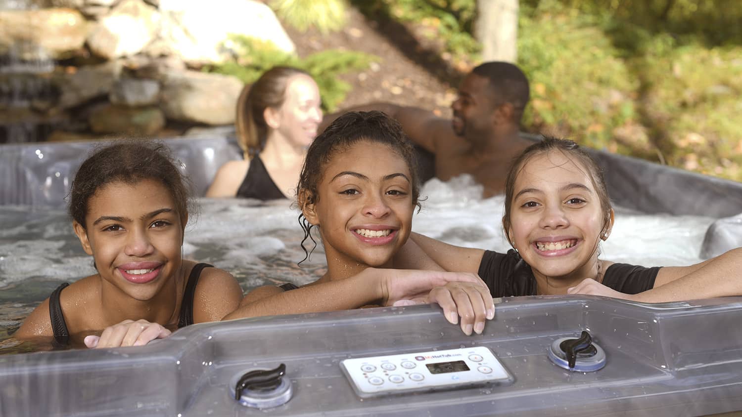 Kids enjoying a hot tub.